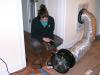 A technician conducts a duct blaster test