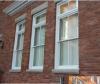The addition of low-E permanent exterior storm windows is typically accepted for most historic preservation projects