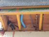 Wrong - Holes in rim joist around pipes and wiring are not air-sealed.