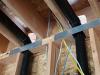 Wrong - Holes in rim joists were cut too large for plumbing pipes and gaps should be air sealed.