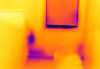 This IR camera image shows a cold spot (in purple) at an electrical outlet on an exterior wall due to lack of insulation; some streaking is also visible and indicates air leakage.