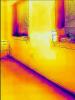 Wrong - This IR image is showing a lack of air-sealing is allowing cold air to enter the home around the windows and at the base of the wall.