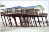 Wrong - The pile foundation of this home nearly collapsed from coastal storm surges because the piles were not embedded deeply enough in the ground. 