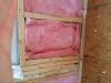 Wrong - Insulation beneath window is compressed and there are more support studs than necessary to left of window.