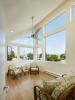 ENERGY STAR-rated ceiling fans and openable windows oriented to prevailing summer breezes help provide low-cost cooling.