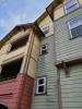 Wrong - The gutter is missing kick-out flashing causing wall and window damage beneath it.
