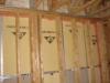 Fire-rated sealants or a fire-rated assembly air seal the tops and bottoms of the demising walls that separate one dwelling unit from another ina multifamily building