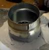 After connecting with sheet metal screws, this take-off collar is then air sealed and further secured using UL 181 fiber-reinforced duct sealant mastic paste.
