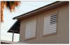 In tropical climates such as Puerto Rico, some houses have metal jalousie louvers instead of glass windows; metal jalousies look like shutters, but typically offer little debris resistance. 