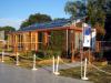 Right – This model home for the Solar Decathlon competition incorporates vertical trellises and retractable exterior blinds to control solar heat gain.
