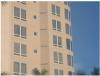 The individual exhaust systems for each dwelling unit in this multifamily building result in large numbers of penetrations in the exterior façade 