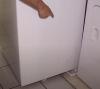 Pieces of PVC pipe make handy rollers for moving a new washing machine into position in its drain pan.