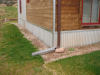 Right - A corrugated metal closure conceals the exterior rigid insulation at the slab edge