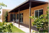 The patio roof on this home provides full shade to large glass doors and windows, reducing the home's heat gains.