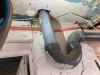 The large hole in the subfloor for this sink drain is a source of air leakage and should be sealed using canned spray foam.
