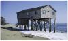 The pilings for this building are showing signs of failure due to a poor siting decision to locate the home too close to the surf. 