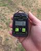 Example of a portable battery-powered carbon monoxide detector being turned on outdoors to get a zero reading before taking the detector inside the home to the location of the gas furnace.