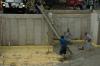 After setting precast concrete basement walls on an 8-inch bed of trap rock, this builder sprayed 2 inches of closed-cell spray foam directly onto the ground then laid piping for radiant floor heating before pouring the concrete floor slab. 