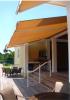These retractable awnings provide shad to this outdoor living space and reduce heat gain and glare within the home.