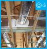 Right: Ductwork is installed in direct contact with lower truss cords. In this picture the main trunk is laying on the truss cords and branch ducts are temporarily held with strapping across truss cords. Ducts are well sealed with mastic