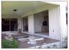 Anchorage failure in sliding glass doors due to negative pressures from hurricane force winds.