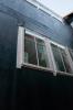 The tape window flashing here is integrated with the roller-applied weather-resistant barrier.