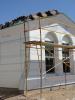 Expanded polystyrene insulation is installed with joints taped and lath attached in preparation for the application of stucco