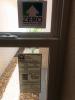 This home bears a DOE Zero Energy Ready Home label on its front window next to the ENERGY STAR window label.