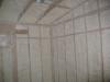 Spray foam insulation is installed in open wall cavities to air seal and insulate