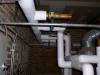Hot water heating pipes insulated with 1 inch of jacketed fiberglass