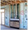 The wall behind the fireplace is an exterior wall and requires a thermal barrier that is continuous with the rest of the wall’s insulation