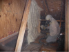 Right – This attic knee wall and the floor joist cavity openings beneath it are being sealed and insulated with spray foam.