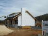 Two layers of high-permeability house wrap are installed to provide a drainage layer between the SIPS and the homes external cladding