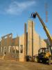 A crane is used to install the SIP fireplace chimney chase