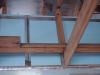 Seal bottom layer of rigid insulation with adhesive, tape and nails