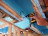 Standard 2 in. by 4 in. stud secures duct chase - made of rigid insulation in this example