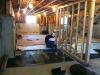 Right - Retrofit of an existing basement slab by adding dimple plastic mat, rigid foam insulation, and a floating subfloor.