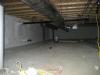 Rigid foam insulation and a thin slab were installed over the dirt and gravel of this sealed crawlspace