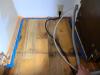 The wood flooring was taped off prior to installing the canned spray foam to protect the wood surface.