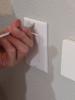 Remove the cover plate of the outlet or switch plate by unscrewing the screws, often one at the top and at the bottom for switches and just one in the center for outlets. 