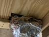 There are large, unsealed gaps where this HVAC duct penetrates the subfloor to supply a floor register; these gaps should be sealed with spray foam.