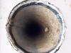 Wrong - Vent hole has no cover or screening and is poorly sealed and flashed to siding.