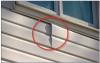 Wrong – For proper detailing of vinyl around windows and other obstacles, use utility trim, punch snaplocks into siding, and do not overlap directly beneath a window. 