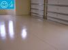 Right – The slab is coated with two coats of epoxy paint to minimize moisture transfer through the slab from the ground. 