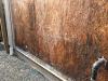 The sheathing has rotted because there was not a sufficient drainage gap behind the stucco cladding