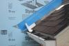 Step 5. Apply self-adhesive flashing over top edge of the wall flashing, diverter, and rigid foam insulation
