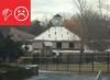 Wrong - The roof insulation panels for this building were not installed in multiple layers with joints offset. The snow melt pattern shows thermal bypasses at the insulation panel joints. 