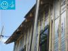 Right-Wall-insulating sheathing is extended up to roof rafters and sealed around the framing with spray foam