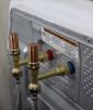 Water hammer arresters were installed on this clothes washer to absorb shocks from water pressure surges reducing noise and wear on the equipment.