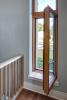 Ultra-efficient, R-9, triple-pane windows have insulated wood frames, argon gas between the panes, and low-emissivity coatings to slow heat transfer.